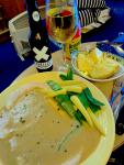 A turkey dinner in peppercorn sauce with veg