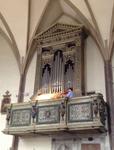 organist (hidden) and violinist