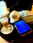 A laptop, an iPad, an iPhone and a Caffe Latte.