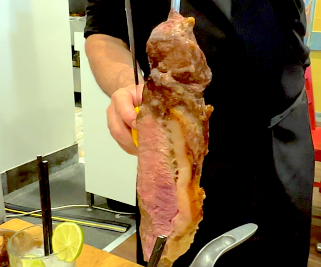 Sliced meat with Caipirinha
