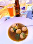 A fine broth with chicken dumplings